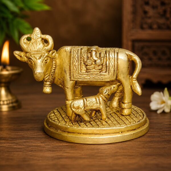 WhatsApp Image 2026-06-24 at 3.14.38 PM Handcrafted Pure Brass Cow and Calf Statue Showpiece for Home Décor, Pooja Room, Office & Gift Purpose | Antique Finish Brass Gau Mata Idol | Size 4 x 2.5 x 3.5 Inches | Weight 500 Grams | Made in India